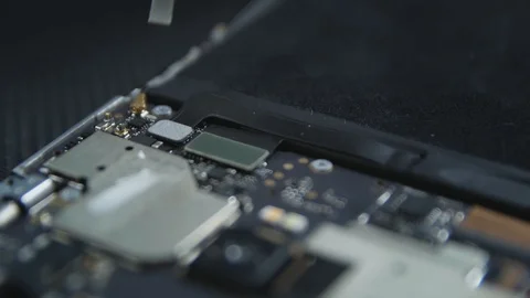 Close-up shot showing the process of cell phone repairing. Hands of repairer  Stockbeeldmateriaal 113398323