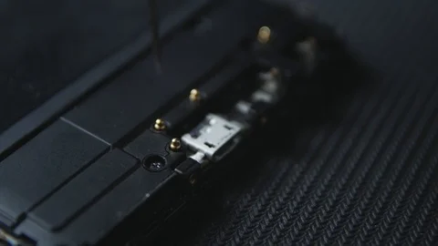 Close-up shot showing the process of cell phone repairing. Hands of repairer  Stock-Footage 113398690