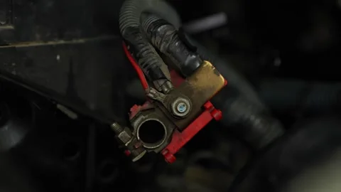 A close-up shot shows a disconnected positive car battery terminal connector  Stock Footage 345109320