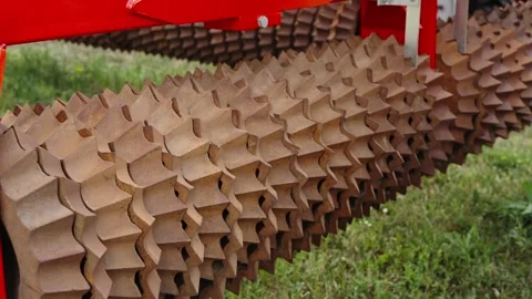 A close-up shot shows the heavy, cast-iron ring sections of a Cambridge roll Stock Footage 339911145