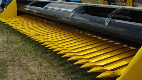 A close-up shot shows the long, bright yellow row lifters or snouts Stock Footage 339911318
