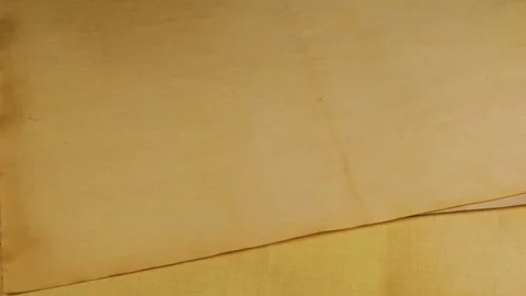 A close-up shot shows sheets of paper being placed one on top of another.  Stock Footage 329736596