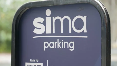 Close up shot of a Sima Parking sign at a valet parking area in Putrajaya Stock Footage 345226684