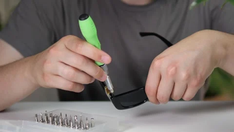 Close-up shot of skilled hands performing meticulous adjustments on premium Stock-Footage 313520682