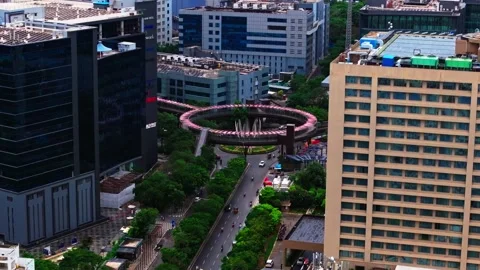 Close up shot of skywalk bridge with roundabout, Westin hotel building and Stock Footage 341685877