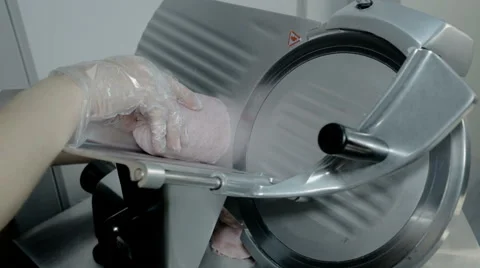 Close up shot slice machine cuts ham and meat Stock Footage 65805869