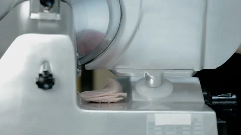 Close up shot slice machine cuts ham and meat Stock Footage 65805879