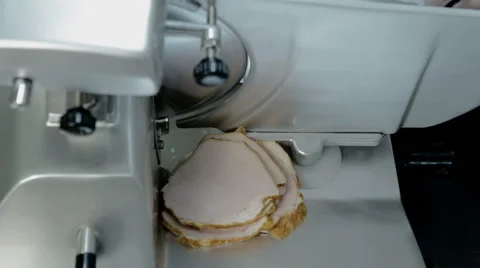 Close up shot slice machine cuts ham and meat Stock Footage 65806286