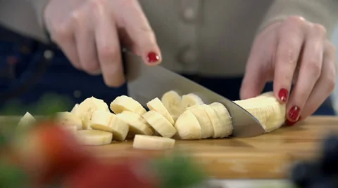 Close shot of slicing banana into tiny pieces Stock Footage 37173527