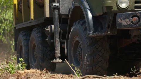 Close-up shot in slow motion of large timber truck hauls cut trees Stock Footage 220659233