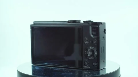 Close up shot of a small black pocket camera, aluminiaum built, function Stock Footage 230140197