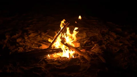 Close up shot of a small Bonfire at night time on the beach. Stock Footage