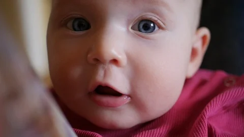 Close-up shot of a small child's face. Blue eyes. Stock Footage 127514295