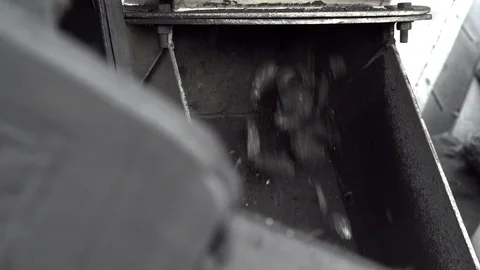 A close-up shot of a special machine dispensing coal at the coal mine Stock Footage 101505257
