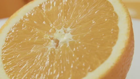 Close up shot of a spinning orange slice Stock Footage 168283749