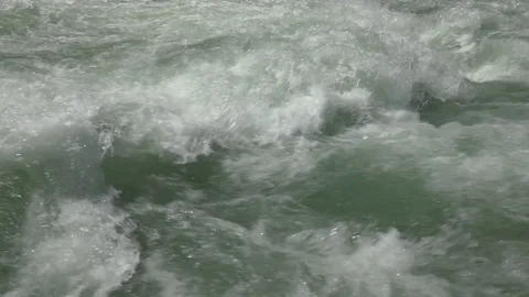 Close-up shot of splashing water from a fast-flowing river Video stock 96540932