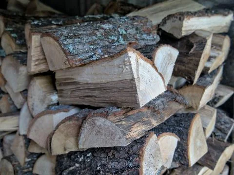 Close-up shot of split oak wood stacked in a pile Stock Photos