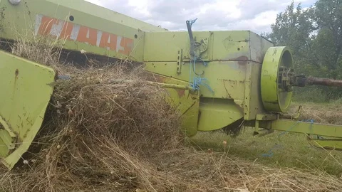 Close Up shot of a square hay baler in Transilvania Romania Video stock 112190878