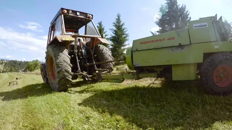 Close Up shot of a square hay baler in Transilvania Romania Stock Footage