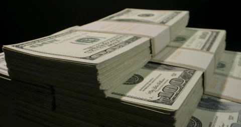 Close up shot of stack of 100 US dollars bills rotating on table. Big money Stock-Footage 153048693