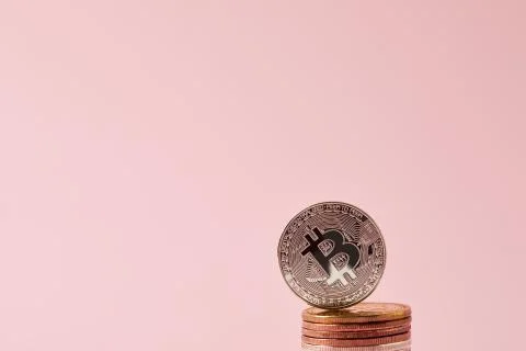Close-up shot of stack of bitcoins isolated on pink Foto stock