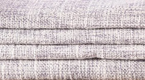 Close-up shot of a stack of gray linen kitchen napkins, showcasing elegant ho Stock Photos