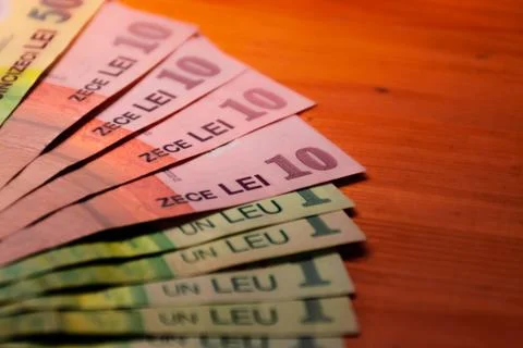 A close-up shot of a stack of Romanian currency (lei) banknotes Stock Photos