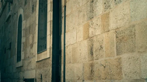 Close up shot of stone wall with sign Via Dolorosa and Hebrew 動画素材 44876652