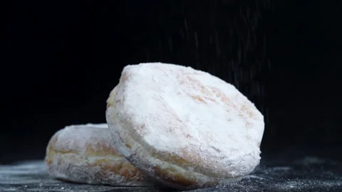 Close up shot strew icing sugar to Donut with toping Видео 135859277