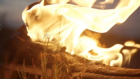 Close-up shot of strong bright flame Burning boots at summer night Slow motion Stock Footage 95910154