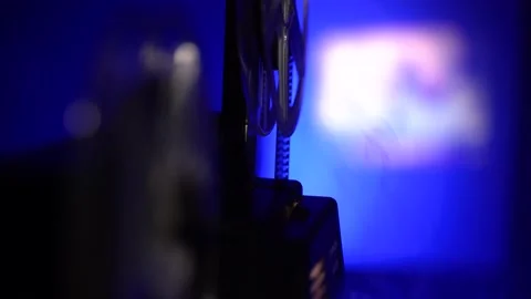 Close up shot of super 8 camera film projector, blue light and smoke Stock Footage 146868022