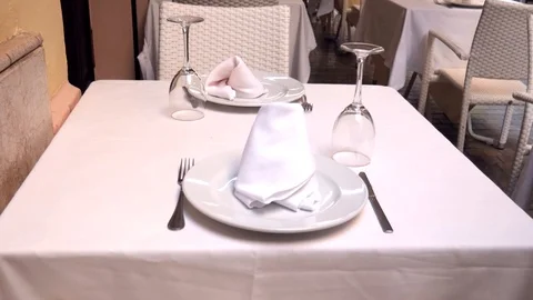 Close up shot of a table set with nice glass plate and napkin. Stock Footage 117835479