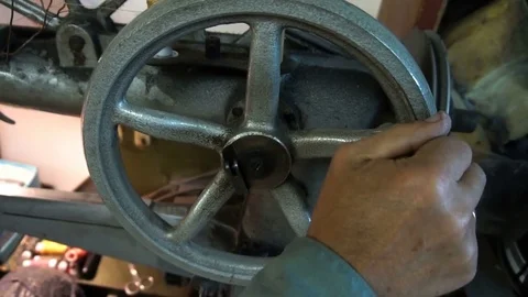 Close up shot of a tailor behind a sewing machine Stock Footage 77872245