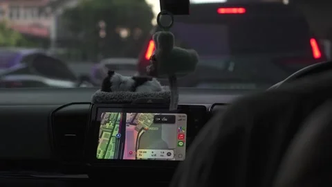 Close-up shot of a taxi driver using their maps to take a client to their Stock Footage 301839972