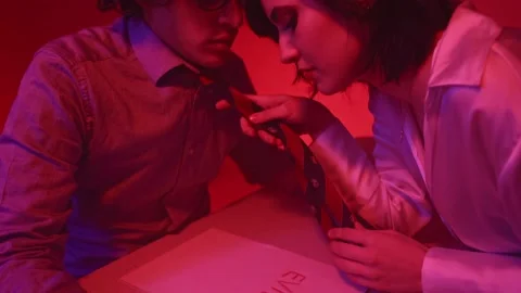 Close-up Shot of a Teacher Writing "Devil" on a Piece of Paper for a Student Stock Footage 235898906