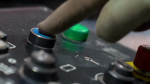 Close Up Shot Of A Technician Operating A CNC Machine, Pressing Buttons On The Stock-Footage 332606412