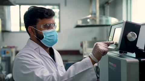 Close Up Shot Of A Technician Testing Textiles For Chemicals In A Controlled Stock Footage 333963813