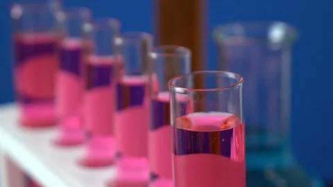 Close-up shot of test tubes on blue background Stock-Footage 111306265