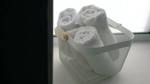 Close up shot of three massage white towel lying in basket prepared for Stock Footage 172531690