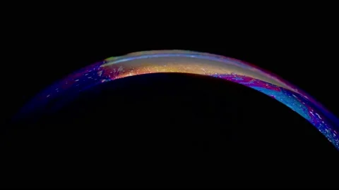Close-up shot of top of soap bubble with beautiful blue-pink colored surface Stock Footage 146530071