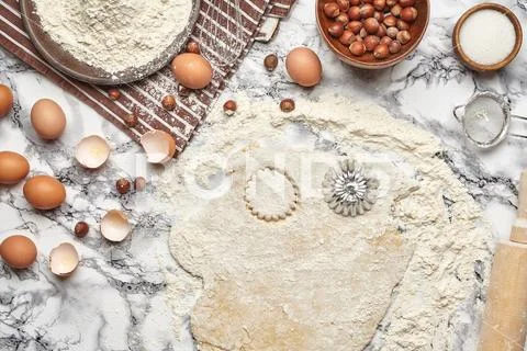 Close-up shot. Top view of a baking ingredients and kitchenware on the marble Stock Photos