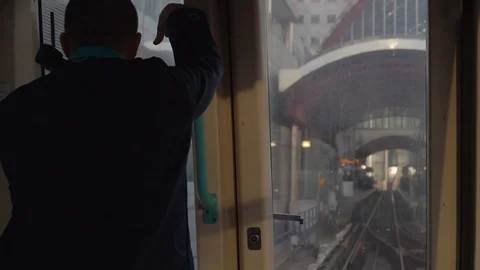 Close up shot of train driver on London Overground Stock Footage 89782274