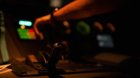 Close-up shot of a train driver's hands while driving a train in a dark night Stock Footage 255911118