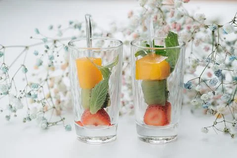Close up shot of two glasses with fruit canape inside. Stock Photos