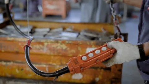 Close-up shot of a two industrial workers transporting metal parts and details Stock-Footage 94999150