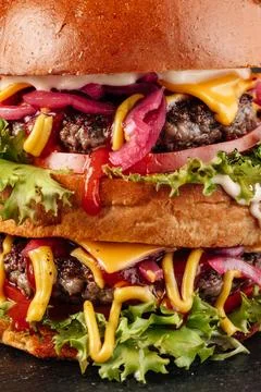 Close-up shot of a two-layer gourmet burger. Stock Photos