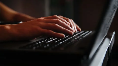 Close up shot of unknown person typing some text or code on laptop's keyboard Stock Footage 165147948