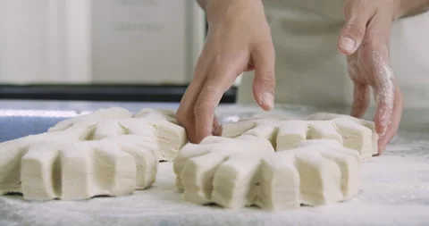 Close-up shot of unrecognizable person's hands handling bread dough inside Stock Footage 277958809