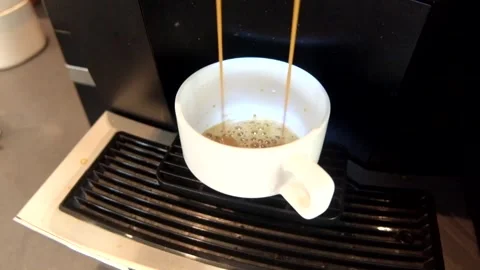 Close-up shot from an upper angle showing an automatic coffee machine brewi.. Stock Footage 339428750