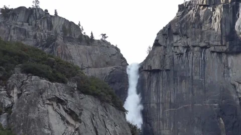 Close up shot: Upper Yosemite falls from afar Stock Footage 241194077